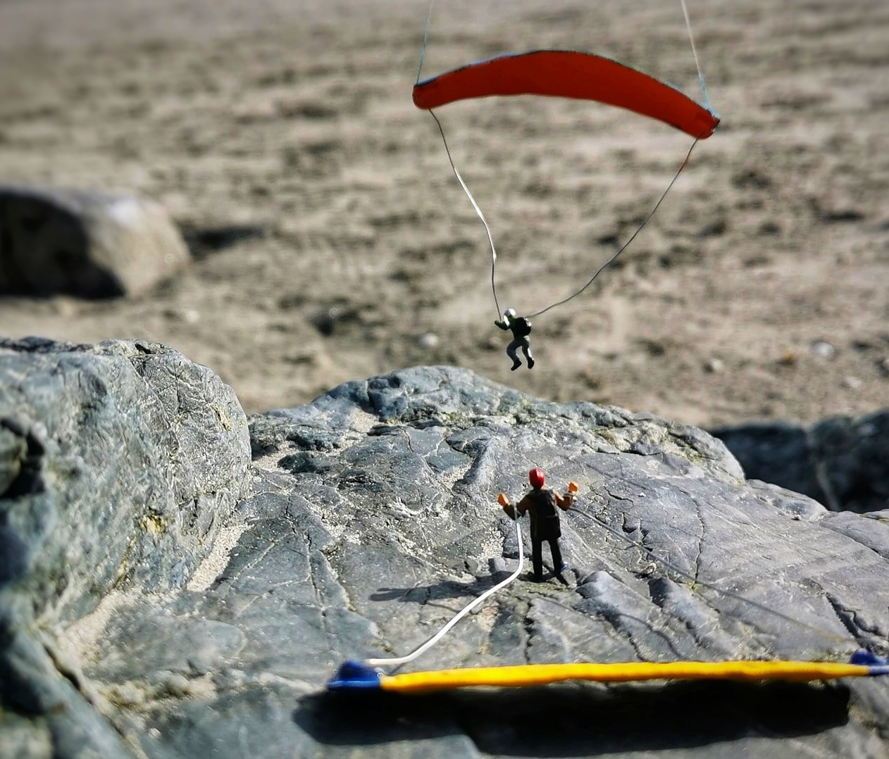 Two man jumping on gliders