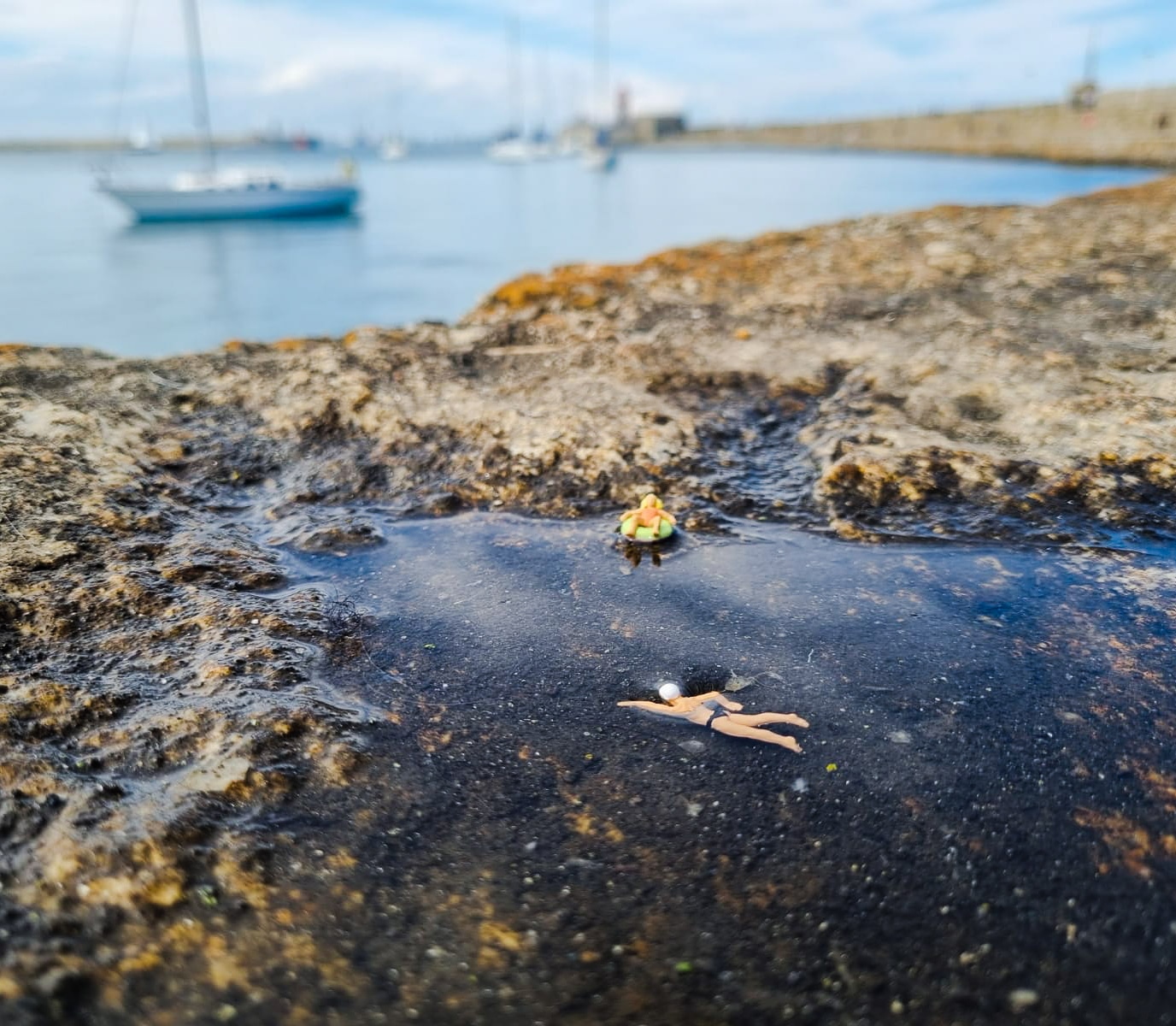 Couple swimming close to a beach